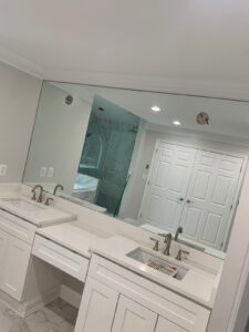 large glass mirror in bathroom