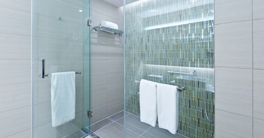 large glass shower doors that may be in need of professional glass repair