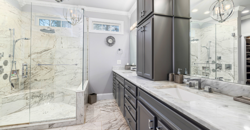 bathroom with a shower that has frameless glass shower doors